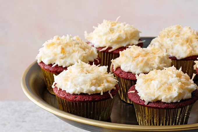 Red velvet cupcakes with coconut frosting