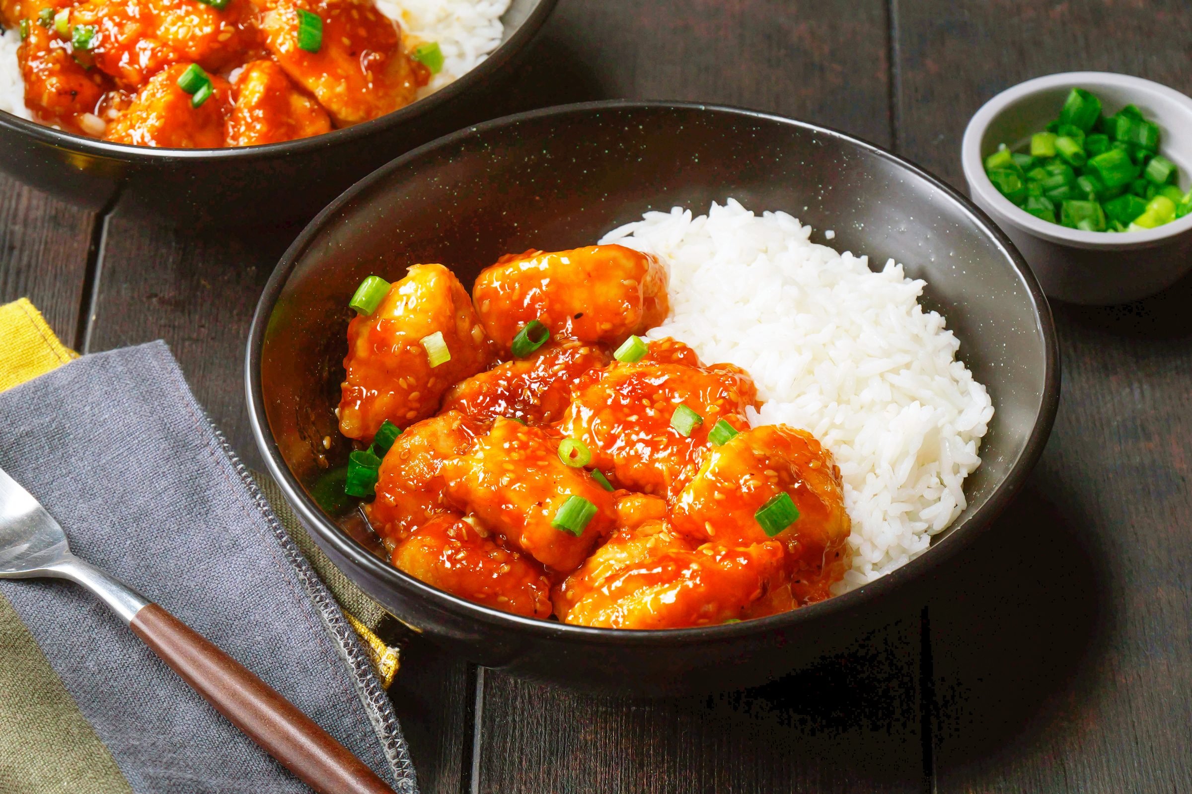 bowl with sesame chicken and rice