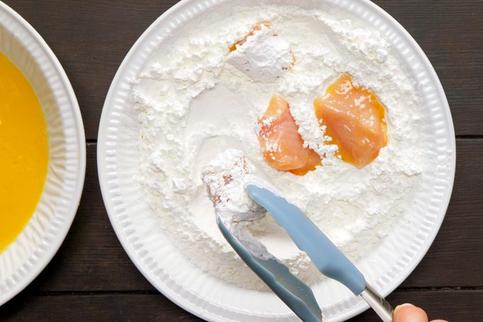 breading chicken in egg and flour