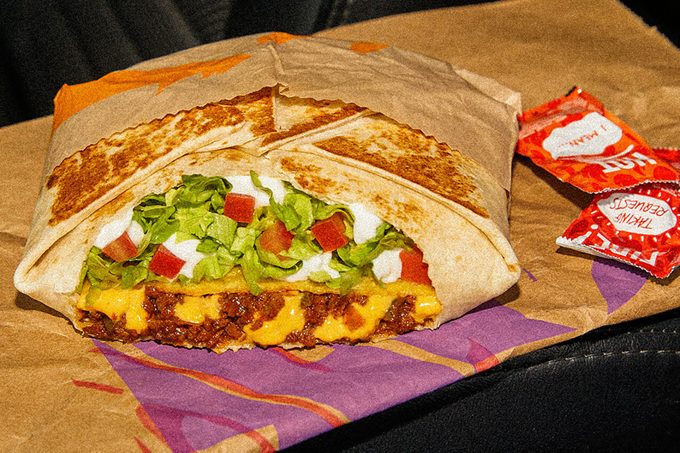 the Vegan Crunchwrap features vegan seasoned beef, cool vegan blanco sauce and warm vegan nacho sauce