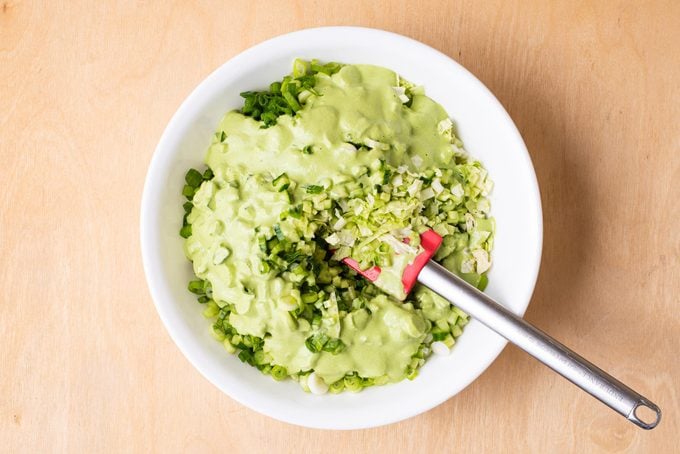 mixing ingredients for Green Goddess Salad