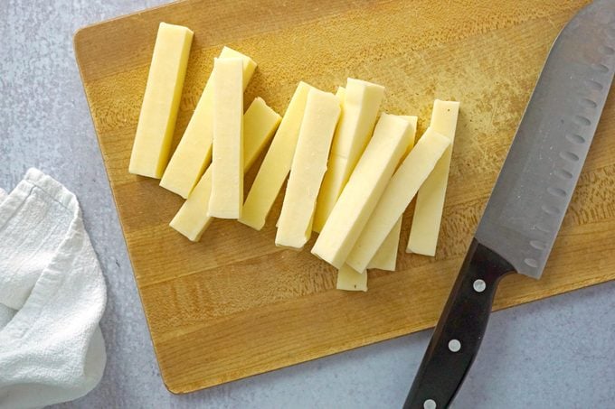 cutting up cheese for Mozzarella Sticks