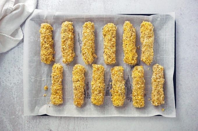 Mozzarella Sticks on a baking sheet