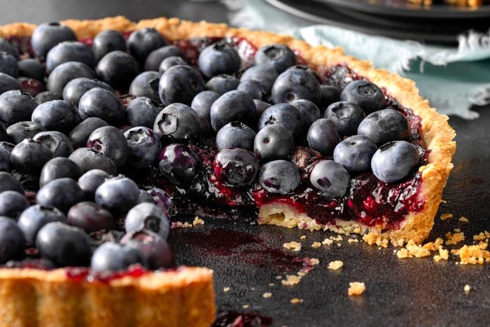 Blueberry Tart on a Black Rough Background