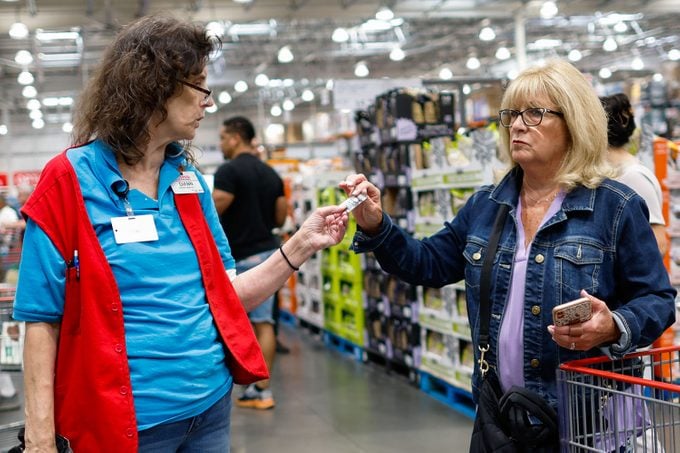 A staff speaks to a customer inside a Costco store in Teterboro, New Jersey