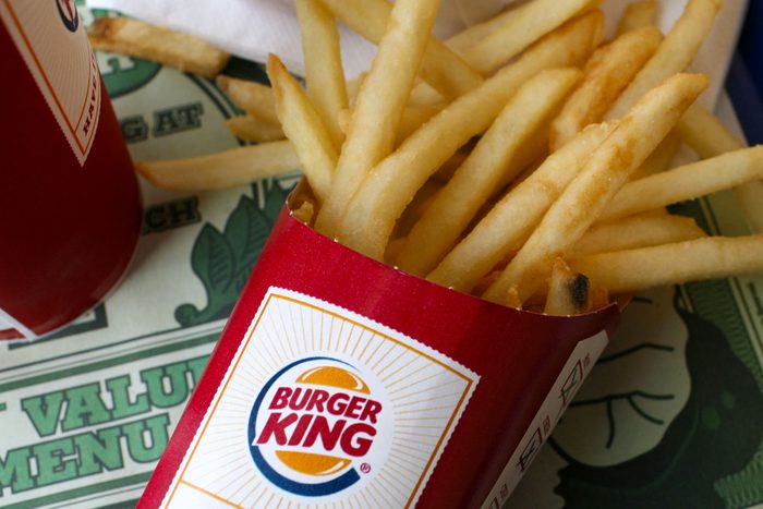 A container of Burger King french fries sit on a tray at a Burger King restaurant