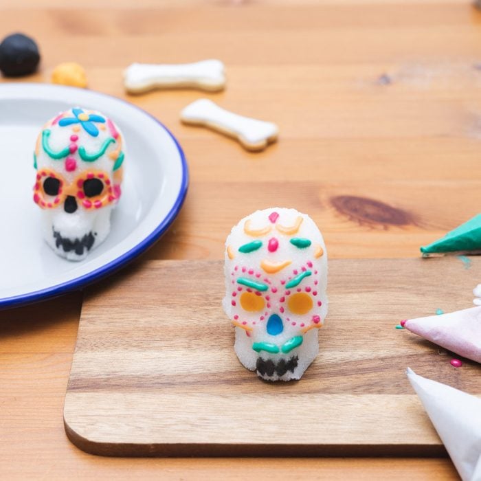 homemade sugar skulls for day of the dead decorated with royal icing