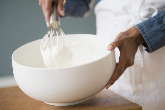 woman whisking whipped cream