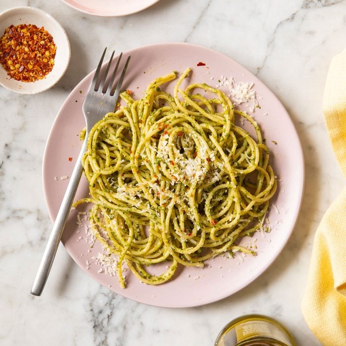 Pesto Pasta served with parmesan cheese and red chilli flakes