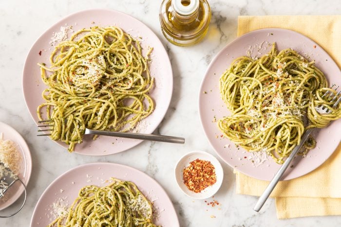 Pesto Pasta served with parmesan cheese and red chilli flakes