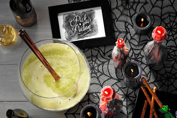 Witches brew punch with pick your poison sign; Halloween party