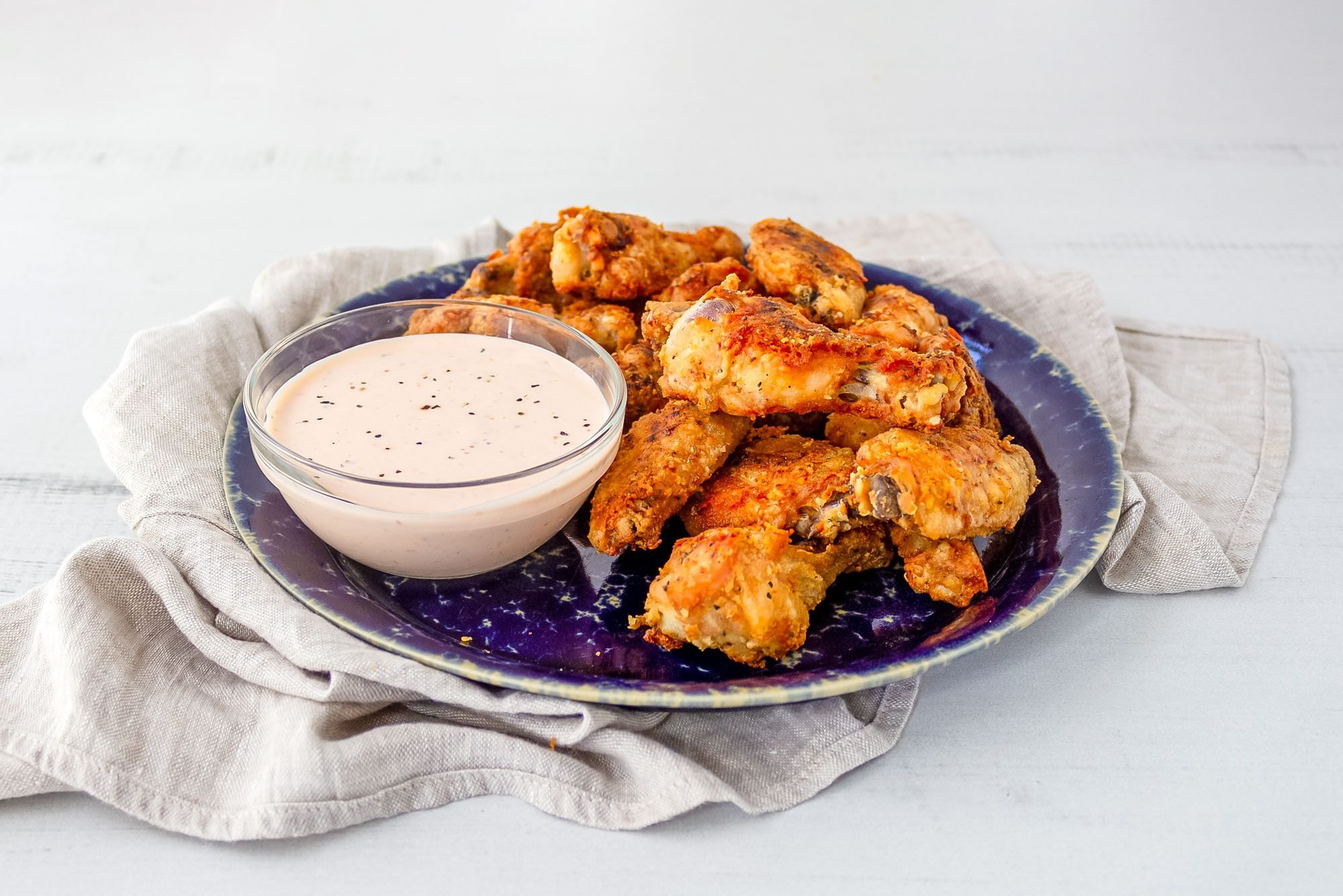 https://www.tasteofhome.com/wp-content/uploads/2023/08/Crispy-Oven-Fried-Chicken-Wings_Nancy-Mock-for-Taste-of-Home_FT_Oven-Fried-Chicken-Wings.TOH_.Nancy-Mock-6_KSedit.jpg