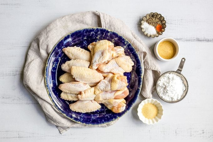 All Ingredients for Crispy Oven Fried Chicken Wings on Wooden Surface