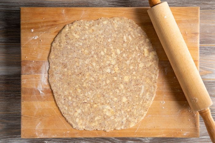 Rolled out dough on the wooden board