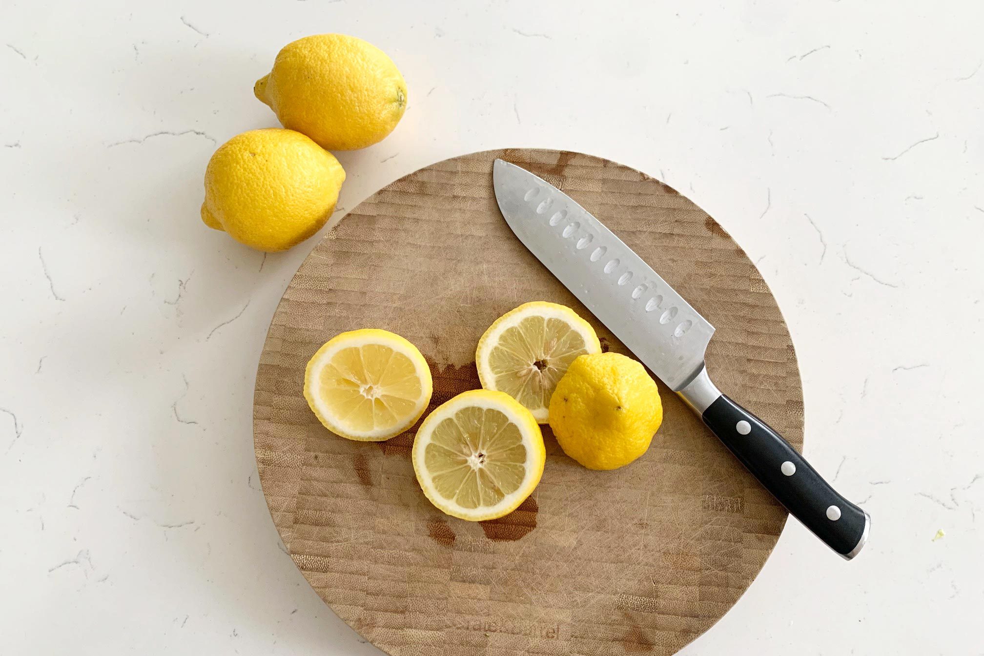 sliced lemon on a cutting board