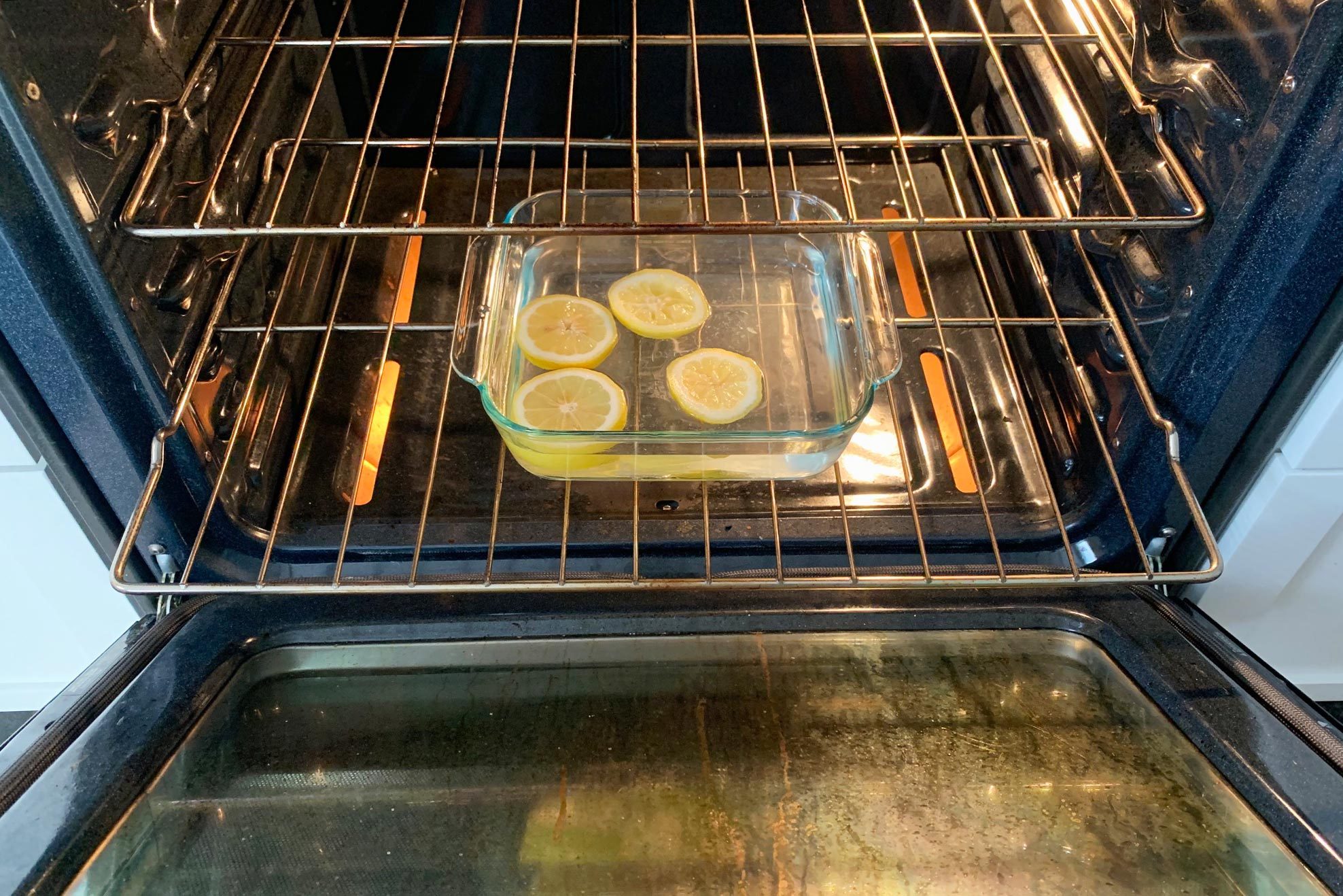 baking dish with lemon in the oven