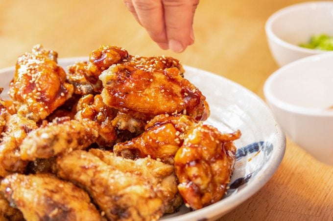 https://www.tasteofhome.com/wp-content/uploads/2023/08/Korean-Fried-Chicken-garnish1_KSedit.jpg?fit=680%2C454