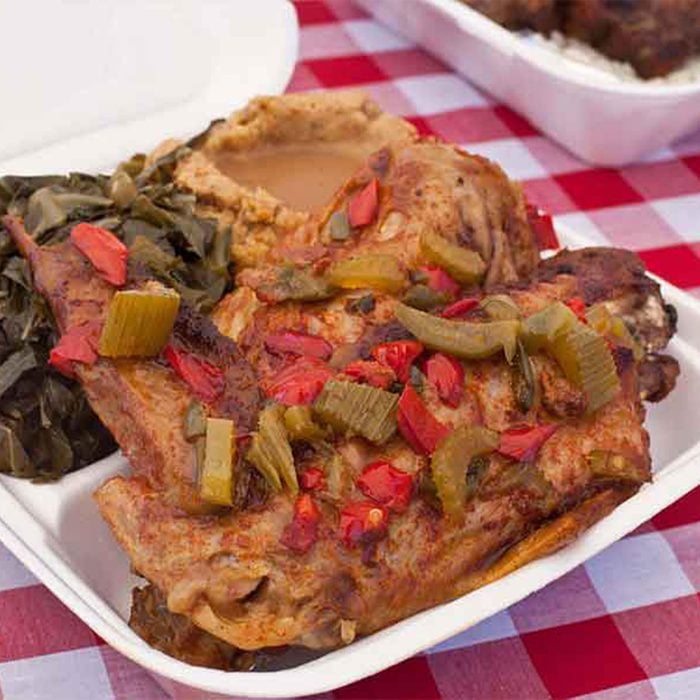 A takeout box of soul food from Dulans Soul Food Kitchen