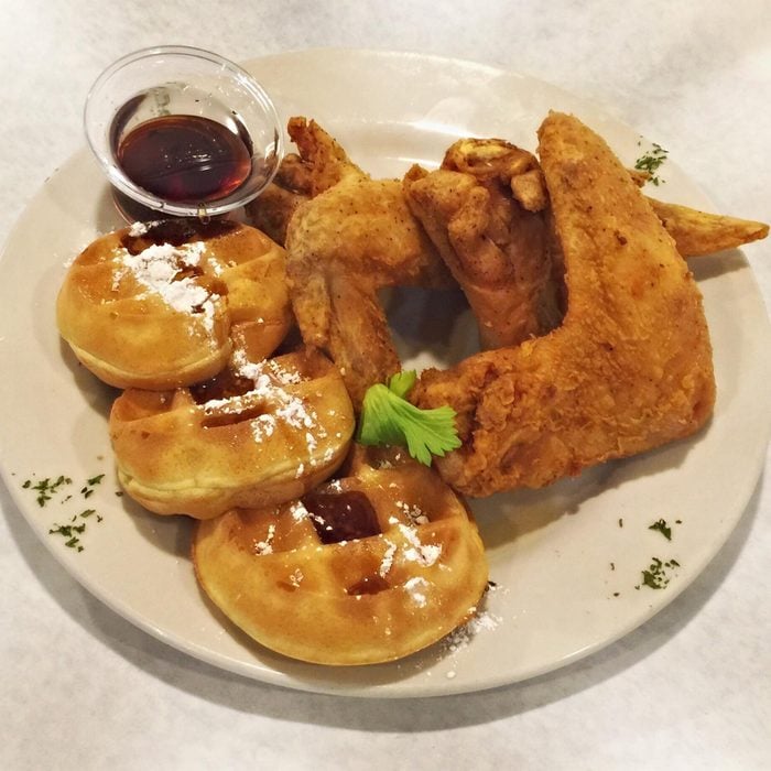 A plate of chicken and waffles from Pearls Place