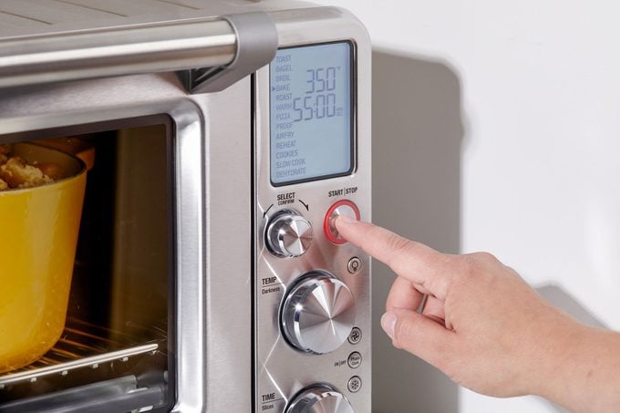 Pressing buttons on smart oven