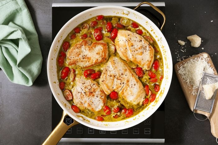 Chicken breast in pan with pesto sauce