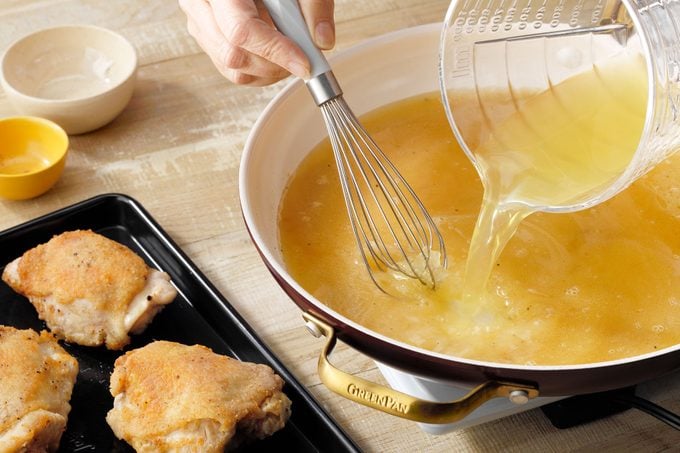 Whisking the gravy in pan 