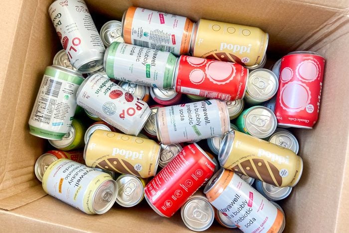 Overhead Shot of Soda Cans in Cardboard Box