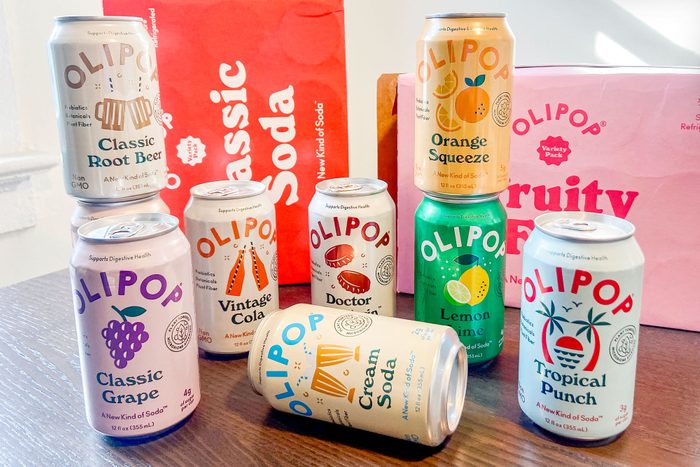 Olipop Soda Cans on Wooden Surface