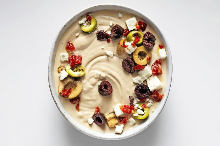 Fresh Hummus served with dryfruits toppings in a small bowl