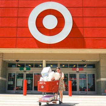 Customer Exits from a Target Store Location With a full, red grocery shopping cart in Miami, Florida