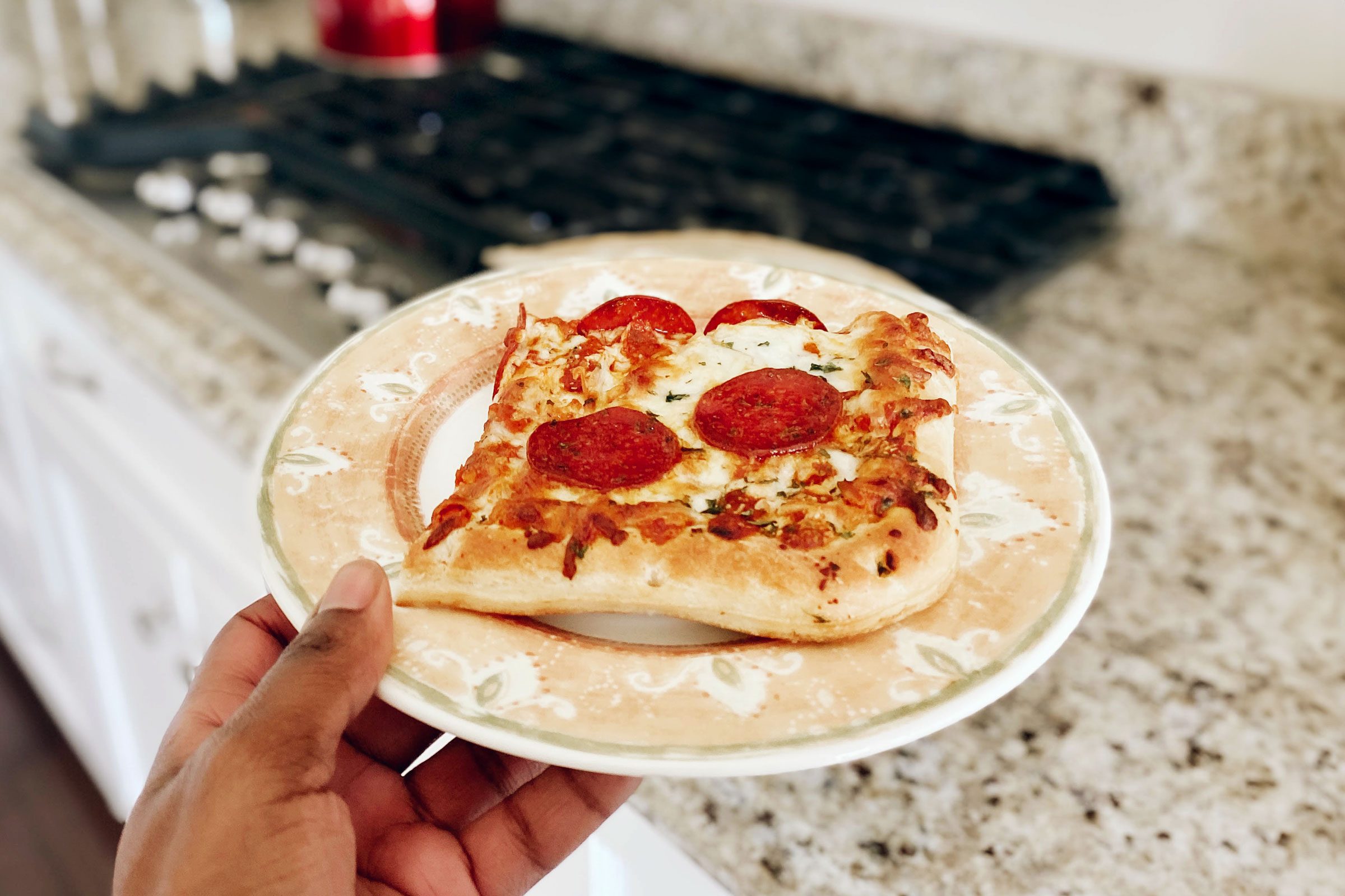 https://www.tasteofhome.com/wp-content/uploads/2023/11/GettyImages-1270685613-how-to-reheat-pizza-JVedit.jpg