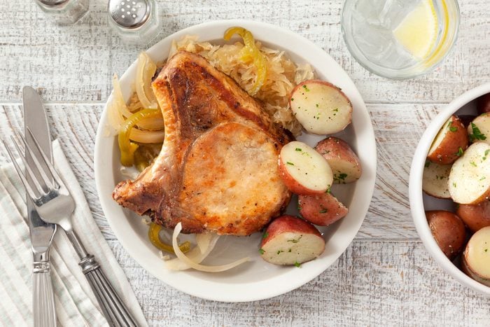 Pork Chops And Sauerkraut served with Potatoes