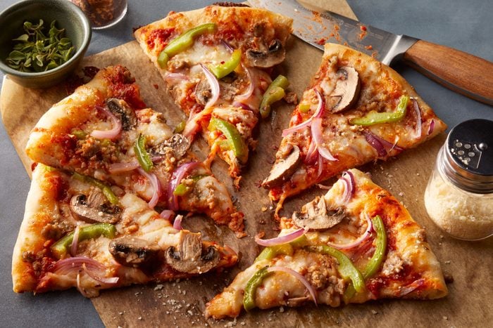 Sausage Pizza cut in slices to eat