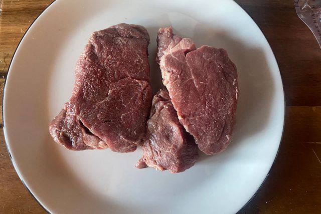 Uncooked Steak on plate