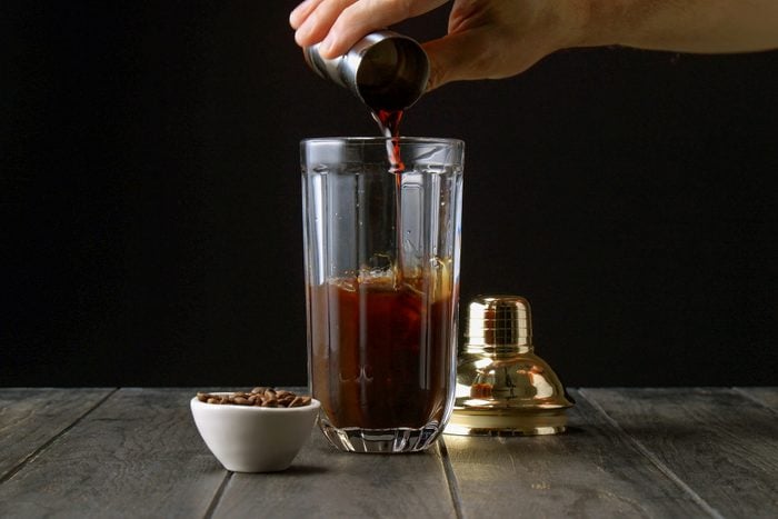 Fill cocktail shaker with ice-cubes, vodka, cooled espresso, Kahlua and simple syrup