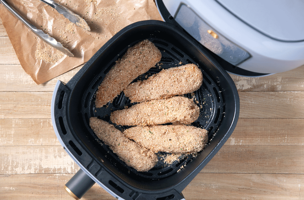 Chicken Tenders Frying in a black pan