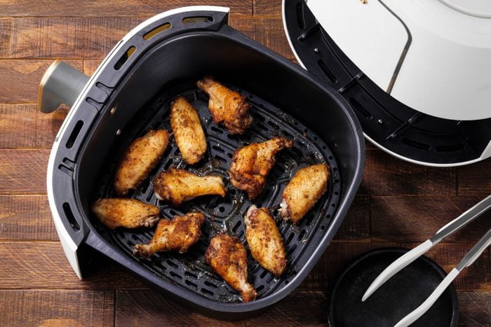Air Fryer Chicken Wings placed in a air fry basket