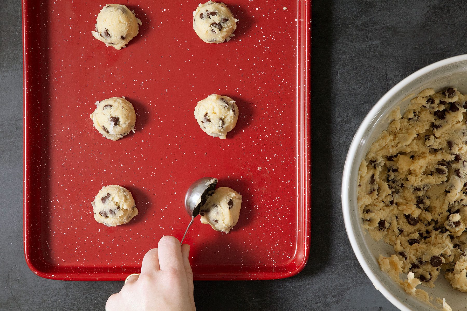 Scooping the cookie dough on baking tray