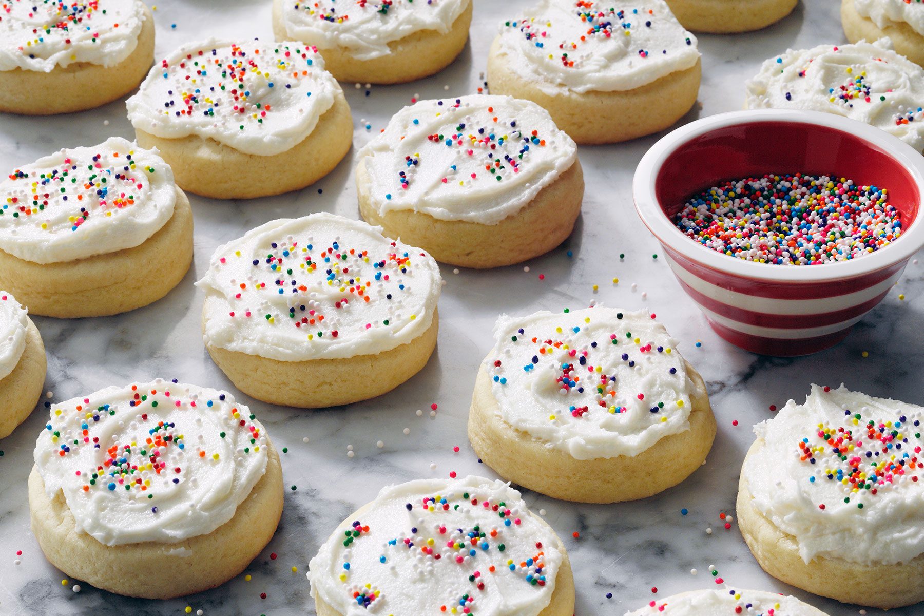 Frosted Sugar Cookies decorated with sprinkles on top
