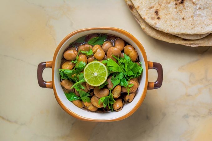 Ful Medames - Dish of Egyptian fava beans with lemon ,cumin ,vegetable