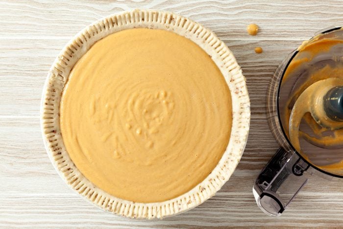 Sweet Potato Pie With Condensed Milk unbaked on wooden base