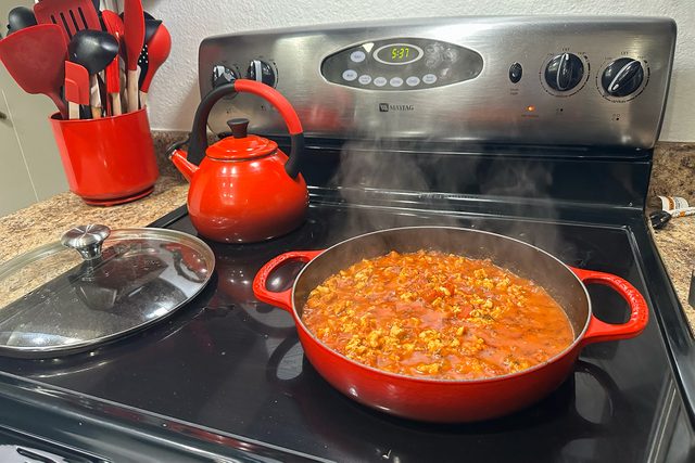  Le Creuset Signature Everyday Pan on glass stove