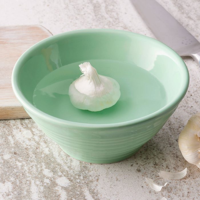 Garlic Bulb in bowl with water