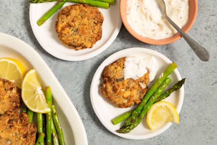 Air Fryer Salmon Patties served in asmall plates with beans and lemons