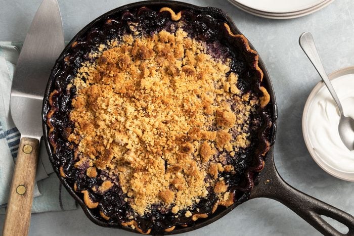Fully prepared Blueberry Crumble Pie in a skillet