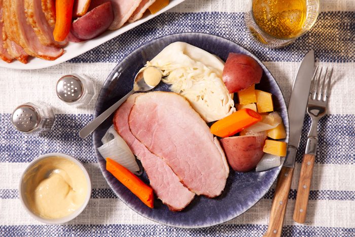 Boiled Ham Dinner served on plate with fork and knife