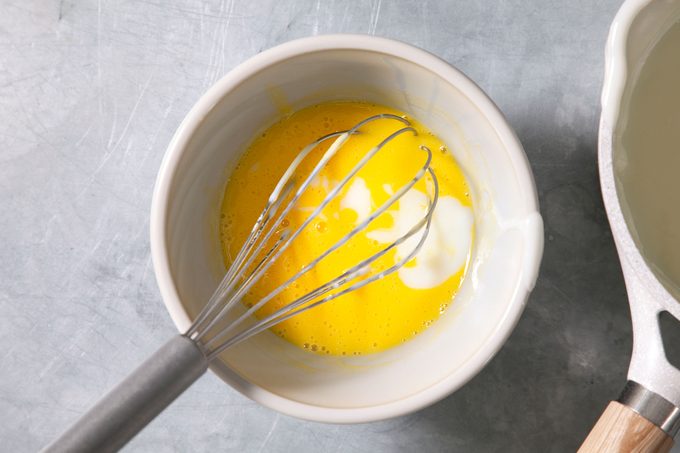 Whisking the eggs in bowl