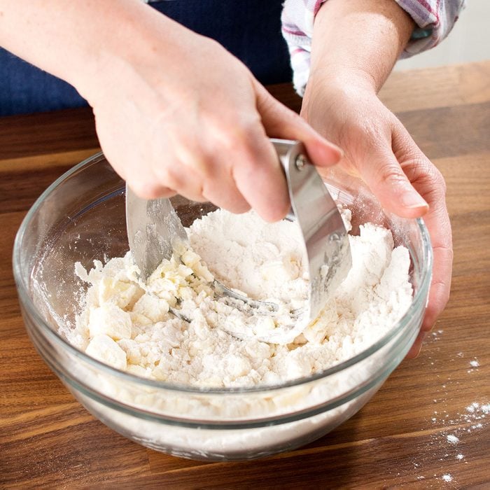 Breaking the dough with pastry blender
