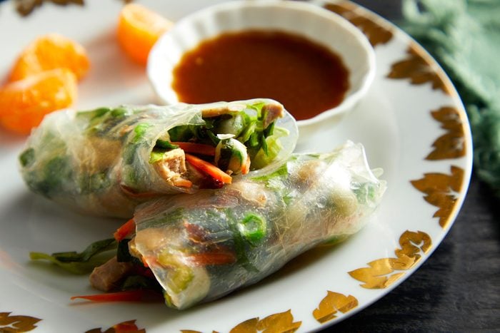 Cut Fresh Spring Rolls on plate with sauce