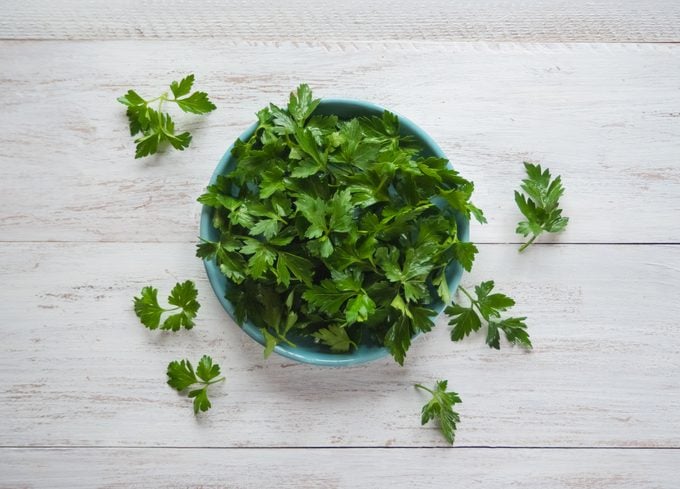 Parsley Leaves Flat Lay. Fresh Parsley On A Plate.